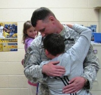 Soldier's homecoming surprises children 