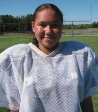 Graves Middle School football player under that helmet, pads is a girl! 