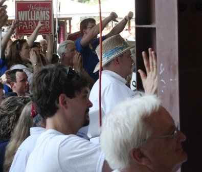 GOP supporter drums on girder in time to chants. He was undisturbed by local officials