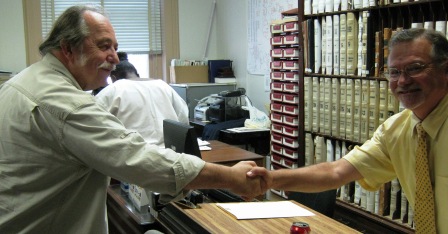 Ivan meets a real voter. Tom Bugg gets the first handshake.