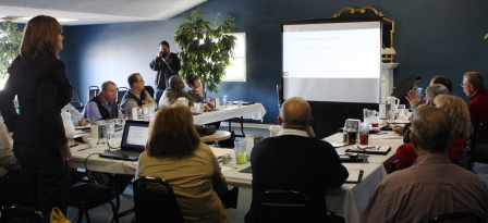 Summit participants view power point marketing presentation